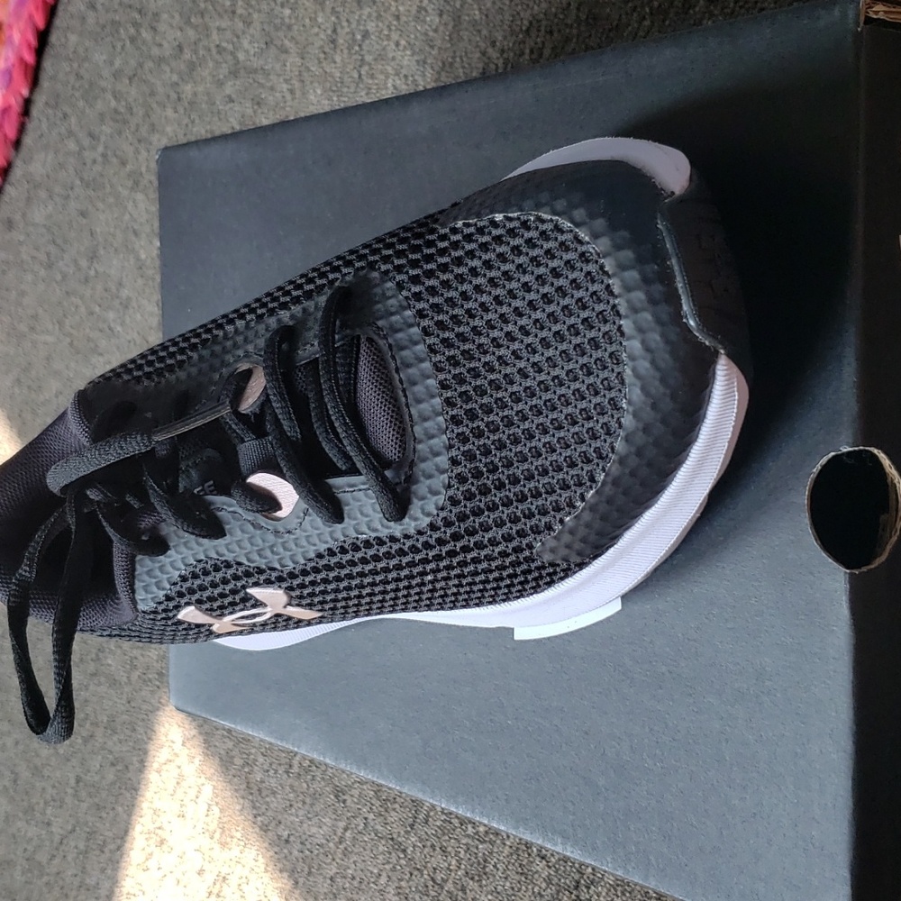 UA sneakers size 7.5, black and gold, never worn.